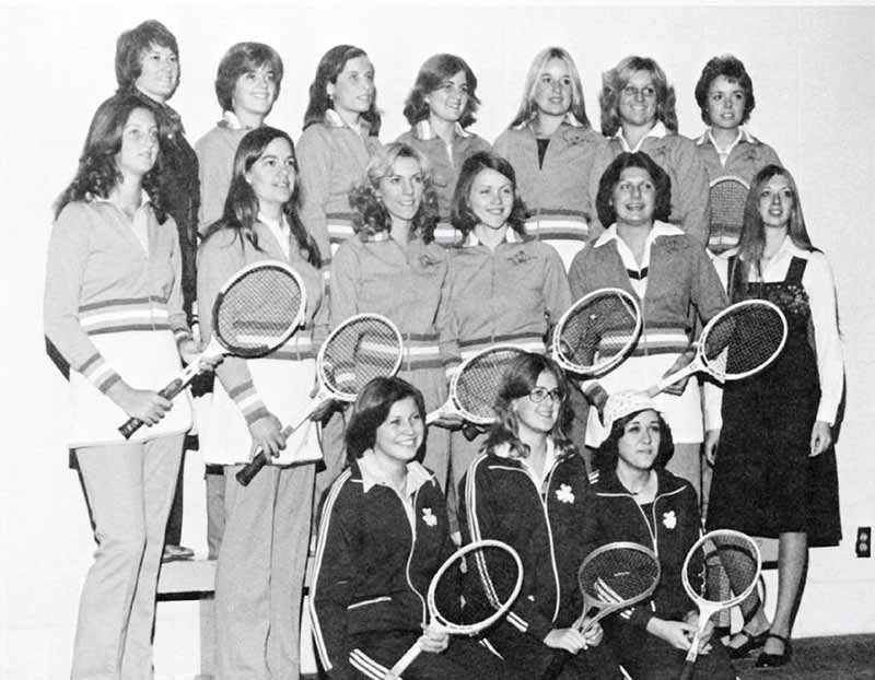 A group of women tennis players with their rackets.