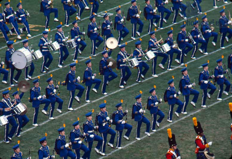 A marching band on a football field.